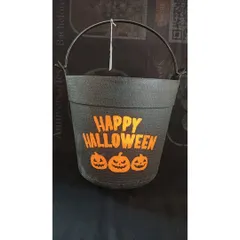 A black Halloween bucket with a 'Happy Halloween' message and pumpkin design that lights up. It's a modern and spooky twist on the traditional trick-or-treat pail.