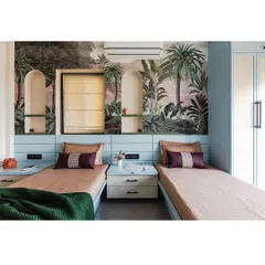 This twin bedroom setup features a beautiful botanical wallpaper that acts as a stunning feature wall. The arched niches with integrated lighting provide a perfect spot for displaying treasures.