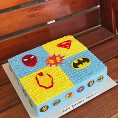 Sheet cakes are perfect for larger gatherings. This one features a fun superhero theme, with sections for Spiderman, Superman, Batman, and Iron Man.