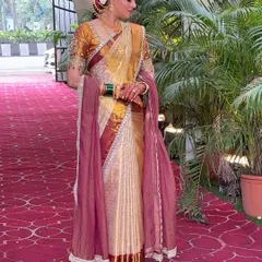 For this bride, we created beautiful fluffy pleats for her Kanjivaram silk saree. This style gives the saree wonderful volume and a grand look, perfect for a traditional wedding ceremony. You can see how each pleat is defined and falls perfectly.