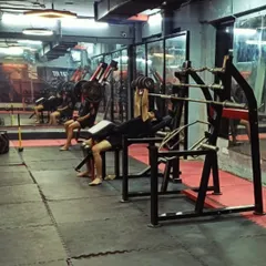 Our weight training section is built for building raw power. Here you can see our members working on incline dumbbell presses and other fundamental strength exercises.