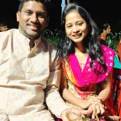 The happy couple, with the groom showcasing his personalized mehendi featuring their names. It's a wonderful way to add a personal touch to the celebration.