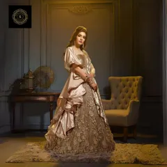 A beautiful golden gown with 3D floral work, perfect for a bride who wants a unique reception look.