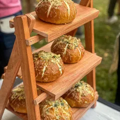 My signature Korean Cream Cheese Buns displayed on a tiered stand at one of my pop-ups. They are always a bestseller.