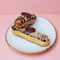 Our Roasted Almond Eclair. The light choux pastry is filled with an almond cream and topped with chocolate and toasted almonds for a delightful crunch.