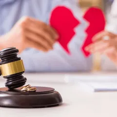 When a marriage ends, I step in to handle the legal formalities with professionalism. This image of a broken heart and wedding rings before a judge's gavel illustrates the sensitive nature of divorce proceedings I handle.
