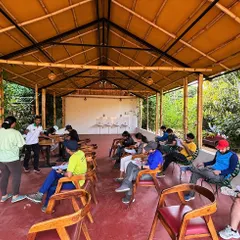 Participants in our training program taking notes during a session. We offer comprehensive training for aspiring trek leaders and outdoor lovers.
