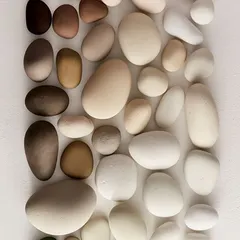 A beautiful and calming color palette inspired by natural pebbles. The gradient of earthy, neutral tones is perfect for creating serene and grounded interior spaces.