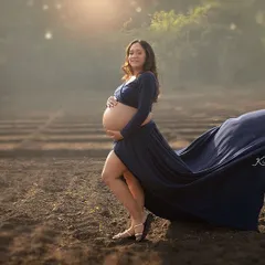 The movement of a flowing gown in an open field adds such a beautiful, dynamic element to a maternity portrait. This shot captures a sense of freedom, beauty, and anticipation.