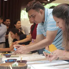 Guests deeply engaged in a block printing workshop. This photo shows the focused and fun atmosphere of our hands-on creative sessions.