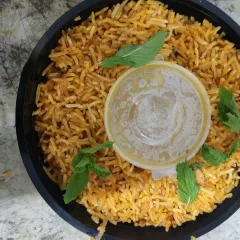 Our delicious biryani is also available in convenient single-serving packs. This Chicken Biryani comes with a side of raita, perfect for a quick and flavorful corporate lunch order.