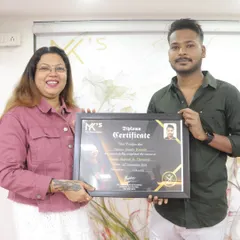 Presenting a diploma certificate to a student who has successfully completed the Hair, Nails, and Chemical course. I am proud to guide aspiring artists on their journey.