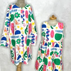 Another take on our abstract print sibling set. Here, we've created a long-sleeved tunic for an older sister and a sleeveless tiered dress for the younger one.