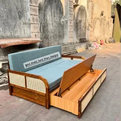 Here you can see the hidden pull-out storage drawer in my sofa-cum-bed design. This piece is a perfect blend of mid-century style and modern functionality.