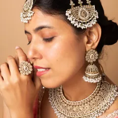 Modeling for bridal jewellery requires attention to detail and the ability to convey emotion. This close-up shot highlights an intricate kundan and pearl bridal set, perfect for wedding campaigns and catalogues.