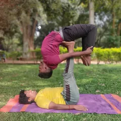 AcroYoga is a practice of trust and letting go. Here, we're exploring an Urdhva Dhanurasana (Upward Bow Pose) variation, relying on balance and communication. It’s a playful way to build strength and connection.