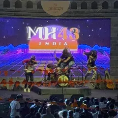 The whole band in our element. Under the lights, in front of the crowd, giving it everything we've got. This is a full-throttle Bollywood rock concert experience, with professional sound and lighting to match the energy.
