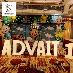 Keeping up with the latest trends is key to creating parties kids love. This Cocomelon-themed first birthday featured a full character backdrop, marquee letters spelling out the birthday boy's name, and a colourful balloon arrangement, making it an immersive and fun experience.