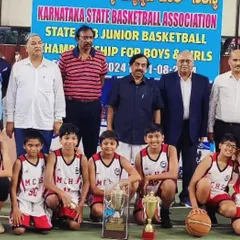 Our U13 boys team celebrating their victory at the State Sub Juniors Championship 2024, standing proudly with officials from the Karnataka State Basketball Association.