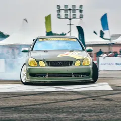 A modified Lexus GS300, a legendary drift car in the Indian scene, goes full sideways, creating a massive cloud of tire smoke.