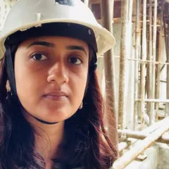 Architect Megha Laddha on site at the 'Nanda Hi-Life' project. Wearing a hard hat is part of the job, as we believe direct involvement and supervision are key to bringing an architectural vision to life with precision.