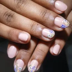 At my studio, perfection is what you get. This delicate, hand-painted floral design on short, natural nails is a great example of my intricate art service.
