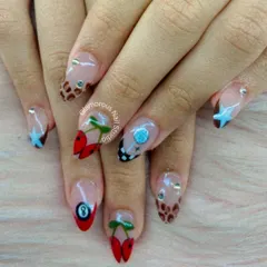 A playful mix of all your favorite things. This quirky set features a variety of designs, including cherries, an 8-ball, chocolate drips, and blue stars.