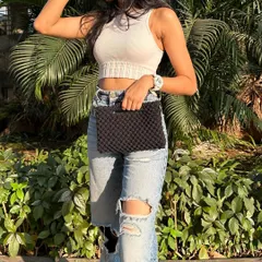 Here is our 3-way bag styled as a chic, handheld macrame clutch. It's the perfect size for your evening essentials like your phone, keys, and wallet.
