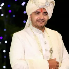 A happy and confident groom. The subtle makeup enhances his features without looking obvious, perfect for his wedding day.