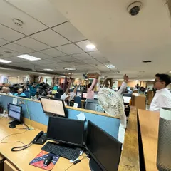 A session in progress at SMC Global's Daryaganj office. Even in a busy office environment, we can find moments of stillness and stretch, raising our arms to open the chest and energize the body.