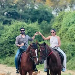 Create a memory you will both cherish forever. Our guided trail rides offer a unique and romantic escape for couples, with quiet moments and beautiful scenery, like this couple sharing a special moment with their horses.