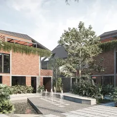 The communal courtyards are the soul of the Kolgaon masterplan. Here, a central water feature and integrated seating are surrounded by lush planting and brick townhouses with vertical gardens, creating a serene and social space for residents to gather.