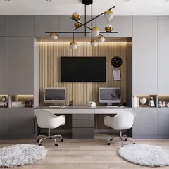 We designed this shared home office for two, featuring a long desk and floor-to-ceiling storage. The central TV and fluted wood panel add a touch of style, while the grey cabinets and integrated lighting keep the space feeling modern and organized.