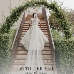 With the veil came the magic. For this Catholic wedding, we styled the bride in a custom white lehenga by Seema Gujral, complete with a dramatic, floor-sweeping veil for a truly magical bridal entrance.