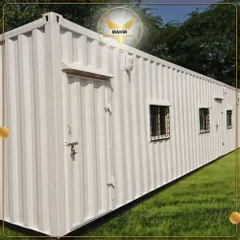 This long container unit features multiple windows with security grills, making it an excellent choice for a larger site office, a security monitoring station, or a multi-person workspace.