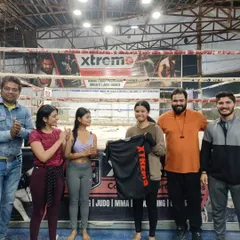 Another shot of our community celebrating success. The smiles and applause show the supportive atmosphere we cultivate here at Xtrem9.
