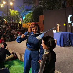 A performer from Mexico's 'Volar Volar' interacts with a young girl in the audience. We love bringing interactive shows to the festival that blur the lines between the stage and the seats, making for a more memorable experience.