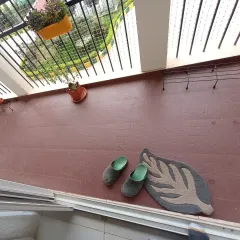 This image shows the balcony before I began the installation. The plain, tiled floor was functional but lacked warmth and character.