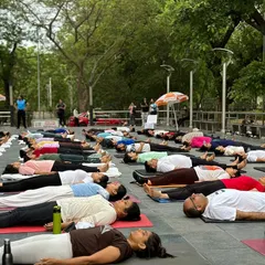 Participants in Savasana (corpse pose) during our International Day of Yoga event in Chandigarh, finding collective rest and serenity.