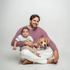 In the studio, my goal is to keep it simple so your family's connection shines through. This portrait of a new dad, his baby, and their ever-loyal beagle is a perfect example of the timeless, clean, and heartfelt images we can create together.