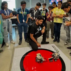 The energy was electric at the MetLife GOSC corporate event. This shot captures the final moments of a Sumo Bots challenge, where older kids gathered to watch the robots they built and coded battle for supremacy. Our corporate workshops are a fantastic way to engage families and promote team building.