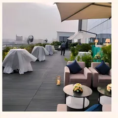 A view of the rooftop venue during setup, with our team preparing the space to ensure everything is perfect for the event.
