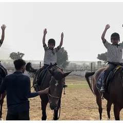 The joy of accomplishment is a shared experience. Our group sessions for young riders focus on fun, encouragement, and learning together in a supportive community.