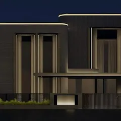 A wider view of the same residential simulation, showing how the facade lighting establishes the building's presence from a distance. This process ensures every detail contributes to a powerful overall composition.