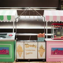 Food stalls are a great addition to any party. Here are custom designed carts for sushi, Turkish ice cream, and popcorn, all matching the party's theme.