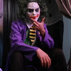 Why so serious? This iconic Joker costume is a Halloween classic for a reason. Complete with the purple coat, green vest, and terrifying mask, this look is guaranteed to make an impression.