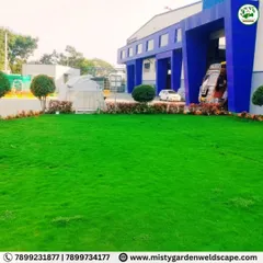 A wide angle view of the 3,300 sq ft natural green lawn we installed for Mother India Farming Private Ltd. A pristine landscape creates a professional and impressive environment for any commercial property.