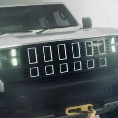 A close-up of the Mahindra Vision T concept, focusing on the unique design of the headlights and grille. This type of detail shot is crucial for launch campaigns.