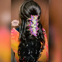 Another beautiful creation from my advance hairstyle class. This look features soft curls and is adorned with butterfly accessories, perfect for a reception or party.