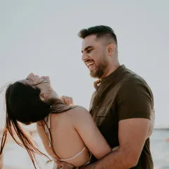 This is the kind of moment I live to capture. Pure, unscripted laughter on a beach in Dubai as the sun sets. It’s not posed or directed; it’s just the simple, beautiful truth of two people completely lost in the joy of being together.
